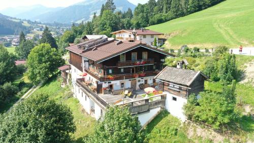 a house on the side of a hill at Hennleiten Hof in Reith bei Kitzbühel