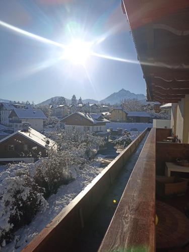 a view from the roof of a building with the sun shining at Gästehaus Alpenblick in Mutters