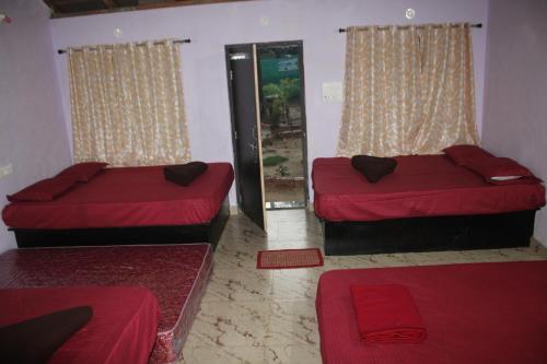 Lova arba lovos apgyvendinimo įstaigoje Prakruti Resort