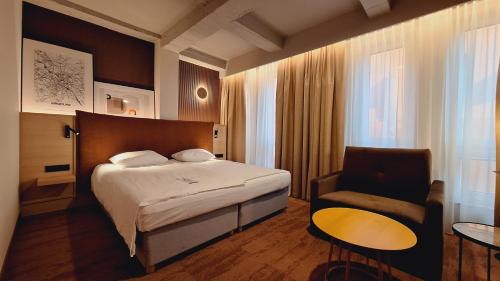 Posteľ alebo postele v izbe v ubytovaní Qubus Hotel Wrocław