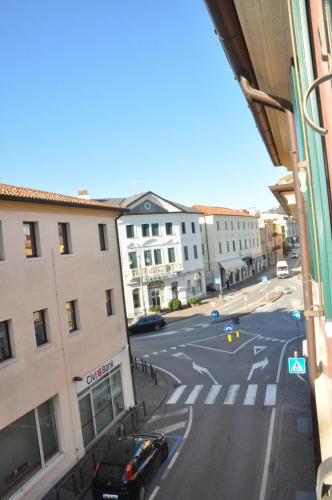 a view of a city street with a car on the road at Ex Casa degli Artisti in Montebelluna