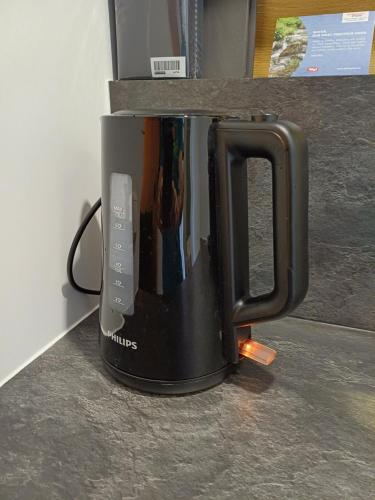 a black coffee mug sitting on top of a counter at Egon's Home - Urlauben in Top Lage in Sankt Jakob in Haus