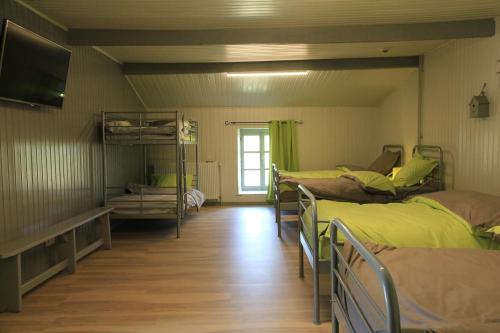 Postel nebo postele na pokoji v ubytování Gîte écologique 14 pers. à Taverneux - Houffalize