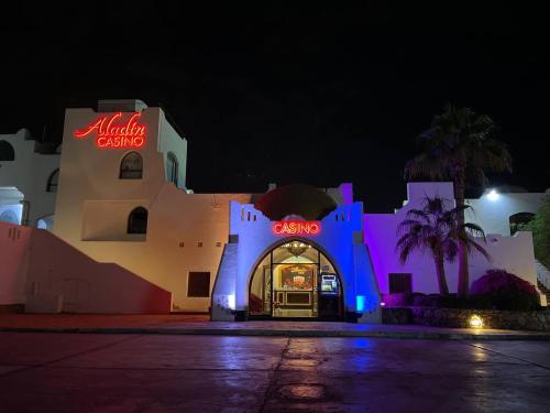 a building with a sign that reads micky casinos at Elisir SPA & Hotel at Sheikh coast in Sharm El Sheikh