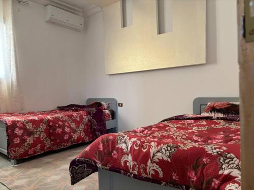 Katil atau katil-katil dalam bilik di Villa luxe calme djerba