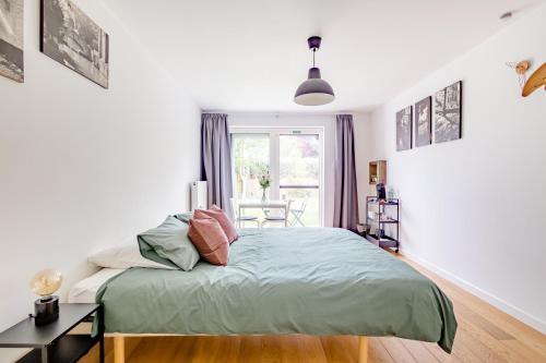 a bedroom with a bed and a window at The Hadewijch - room nearby centre Bruges in Bruges