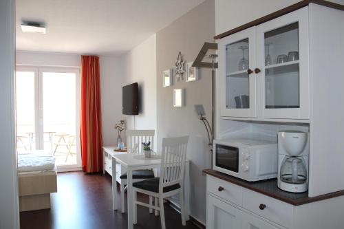 Кухня или мини-кухня в Apartment am Meer
