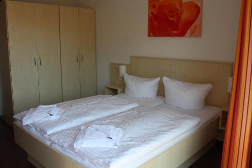 Кровать или кровати в номере Apartment am Meer