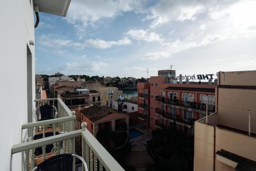 a view of a city from a balcony at THB Felip - Adults Only in Porto Cristo