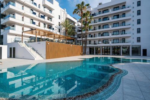 a swimming pool in front of a building at THB Bamboo Alcudia in Port d'Alcudia
