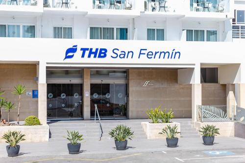 a building with a sign that reads the san fermin at THB San Fermín in Benalmádena