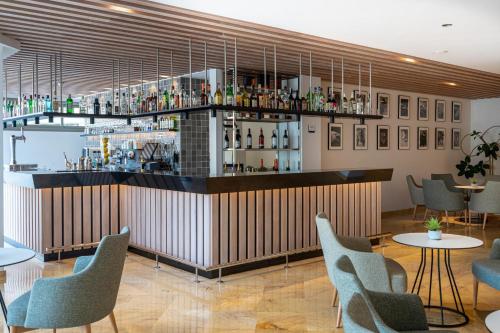 a bar in a restaurant with tables and chairs at THB Maria Isabel - Adults Only in Playa de Palma