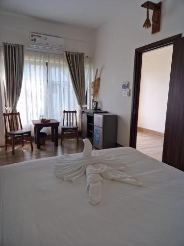 Postel nebo postele na pokoji v ubytování Butterfly Rose Beach Resort Phú Quốc Francophone