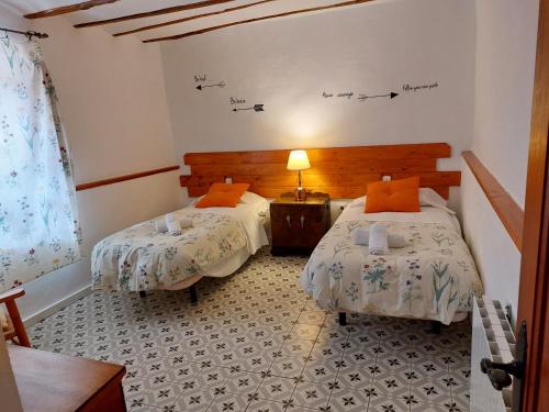Una cama o camas en una habitación de H Rural Molino del Rio Argos
