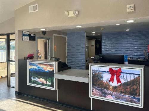 an office with a reception counter with a red bow at Motel 6 Cross Lanes, WV Goff Mountain Rd in Cross Lanes