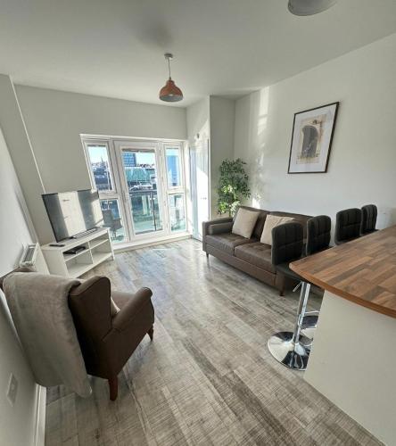 a living room with a couch and a table at Raphael Heights in Newport