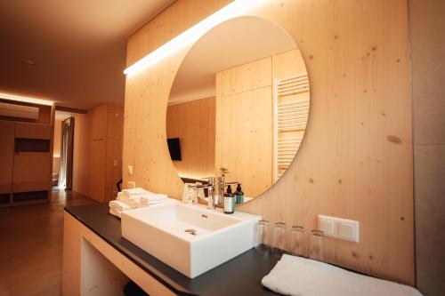 a bathroom with a sink and a mirror at Wohnothek in Eisenberg an der Pinka