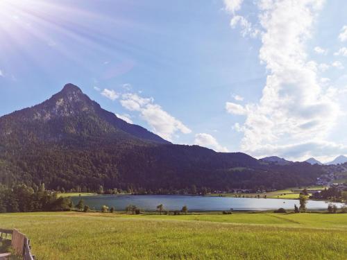 a view of a lake and a mountain at Landidyll am Thiersee in Thiersee