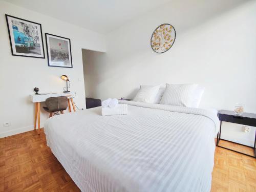 En eller flere senge i et værelse på Métro à 2 minutes Paris centre le Marais