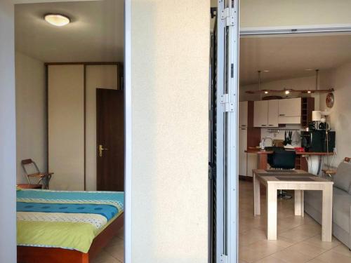 two views of a living room and a kitchen at Boka Residence 7 in Herceg-Novi