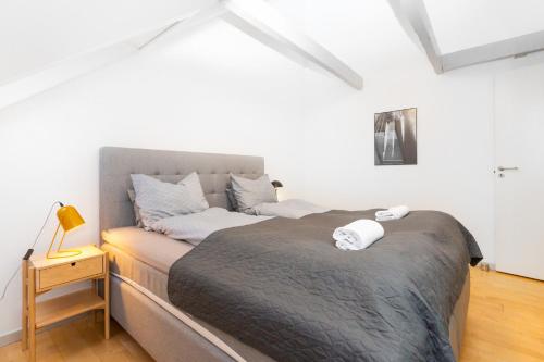 a bedroom with a large bed in a room at Come Stay in An oasis of life, comfort & style in Aarhus