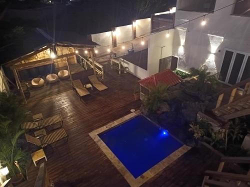 an overhead view of a swimming pool at night at Bamboo Suites in Jan Thiel