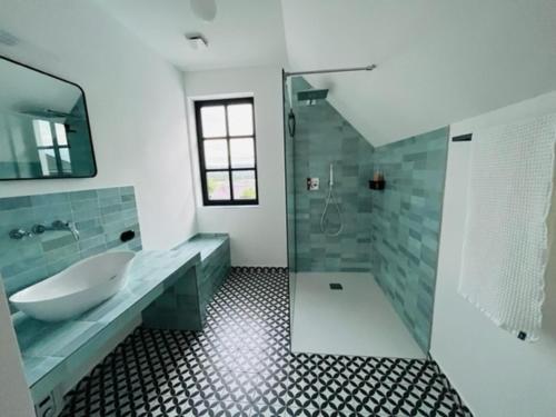 a bathroom with a tub and a sink and a shower at Eifel-Bau-Traum Schlich in Wershofen