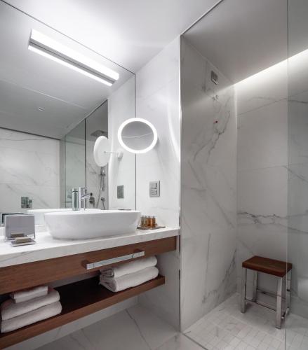 a bathroom with a sink and a mirror at Makedonia Palace in Thessaloniki