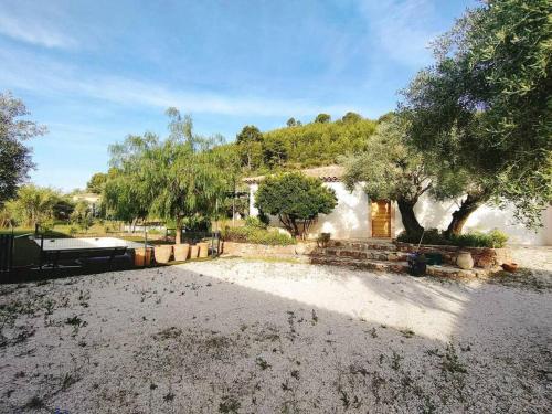 a large yard with trees and a house at Emplacement idéal dans le Var ! in Cuers