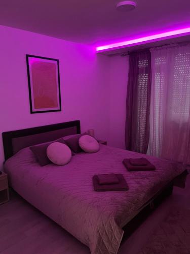 Postel nebo postele na pokoji v ubytování Apartman Rose
