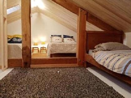 a bedroom with two bunk beds and a mirror at Domaine de la Borde in Puy-lʼÉvêque
