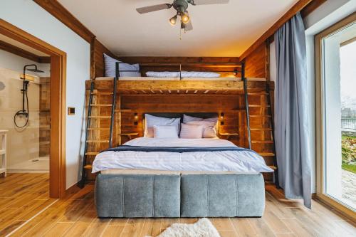 Una cama o camas en una habitación de Rezidence KUPEC
