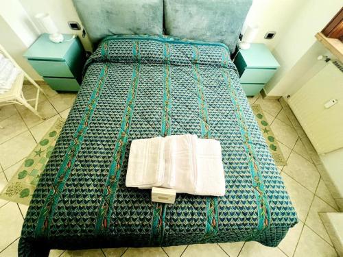 Postel nebo postele na pokoji v ubytování Suite Pascoli 12 - Sanremo