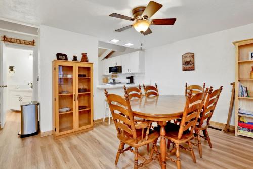 a kitchen and dining room with a table and chairs at 2354-Chairlift Lodge condo in Big Bear Lake