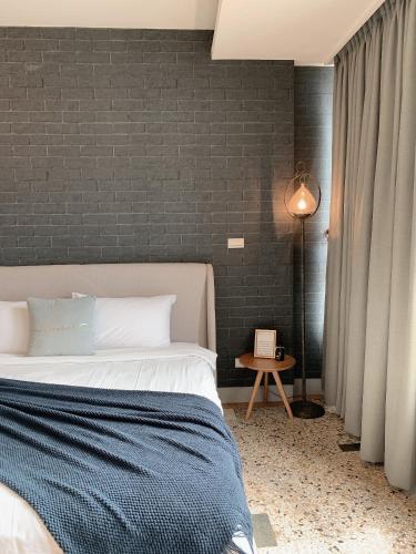 Ένα ή περισσότερα κρεβάτια σε δωμάτιο στο Minilove Homestay