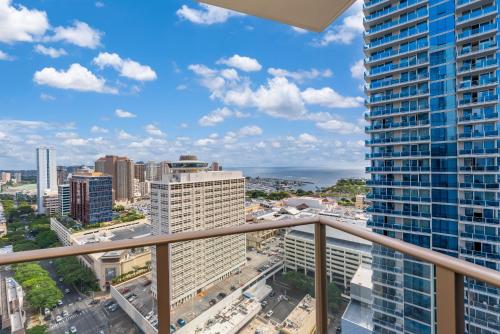 a balcony with a view of a city at Sky Ala Moana 3001 condo in Honolulu