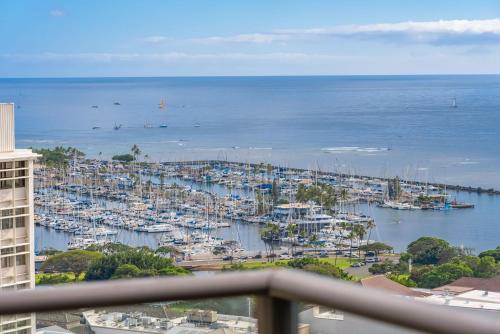 a view of a marina with boats in the water at Sky Ala Moana 3001 condo in Honolulu