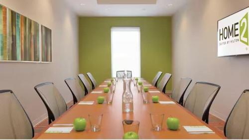 a conference room with a long table and chairs at Home2 Suites By Hilton Falls Church in Falls Church