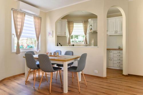 a kitchen and dining room with a table and chairs at ABG House Pest in Budapest