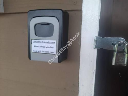 a lock on a door with a padlock on it at DanZaStay@Agok - Near Thai Border in Padang Besar