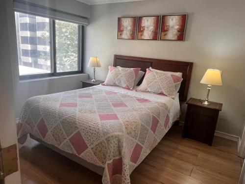 Ένα ή περισσότερα κρεβάτια σε δωμάτιο στο Isabel Suites Vitacura