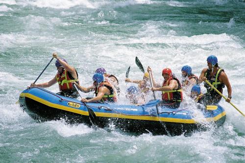 a group of people in a raft in the water at Ferienhaus Mountain View in Spital am Pyhrn