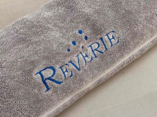 a close up of the words rapping on a gray jacket at Reverie Santorini Hotel in Firostefani