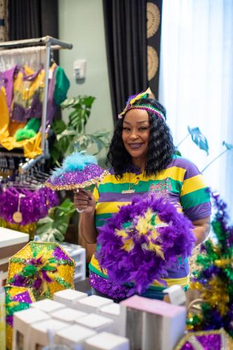 a woman holding a bunch of flowers at Virgin Hotels New Orleans in New Orleans