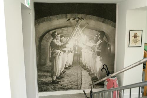 a mural of a baseball team in a tunnel at DAS SALZBERG Hideaway Bad Aussee - Adults only in Bad Aussee