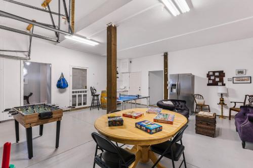 a room with a table and a ping pong ball at Bombastic Home - Steps to Beach - GameRm - Hot Tub - Pet Friendly in Surf City