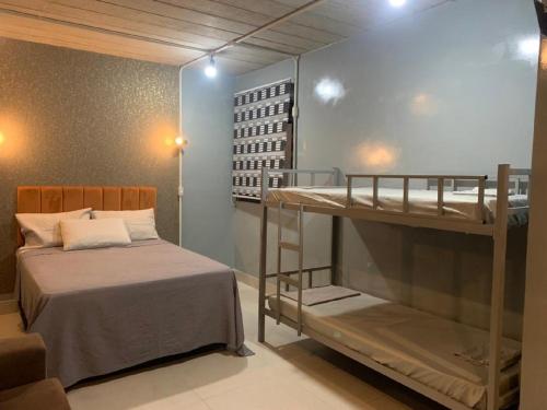 Katil atau katil-katil dalam bilik di Loft Moderno com Ar, WiFi, Estacionamento Gratuito Brás, Expo Anhembi