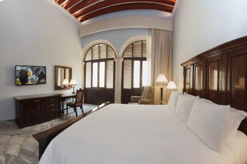 Postel nebo postele na pokoji v ubytování Hotel Lopez Campeche