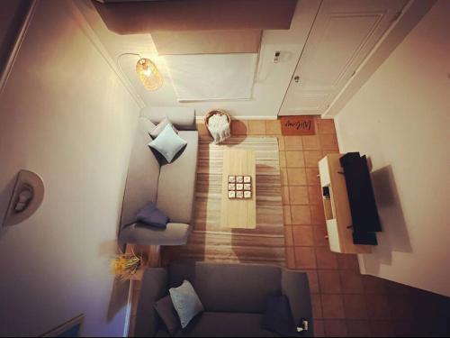 an overhead view of a living room with a couch at Belluca Villa, Middleton Beach in Albany
