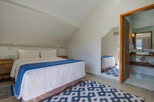 Postel nebo postele na pokoji v ubytování Filimahalo Hotel